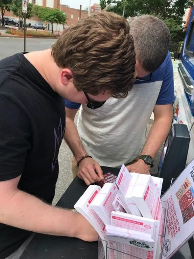 Player's scratching scratch tickets