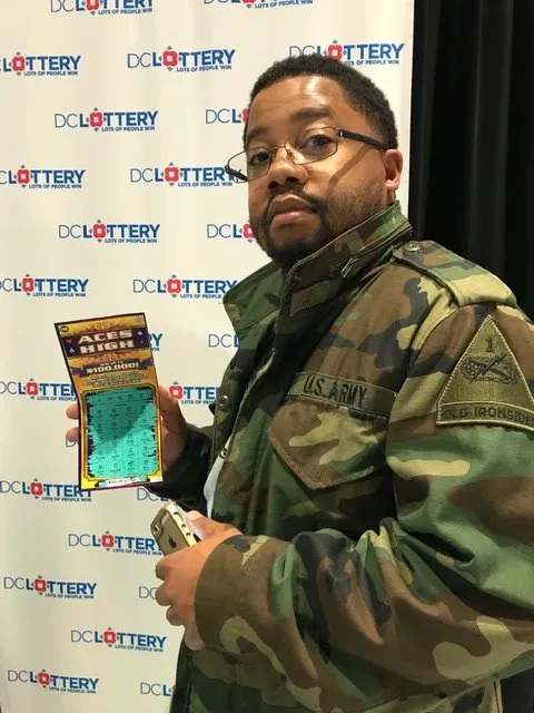 Player holding scratch ticket