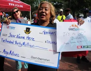 Woman holding large check