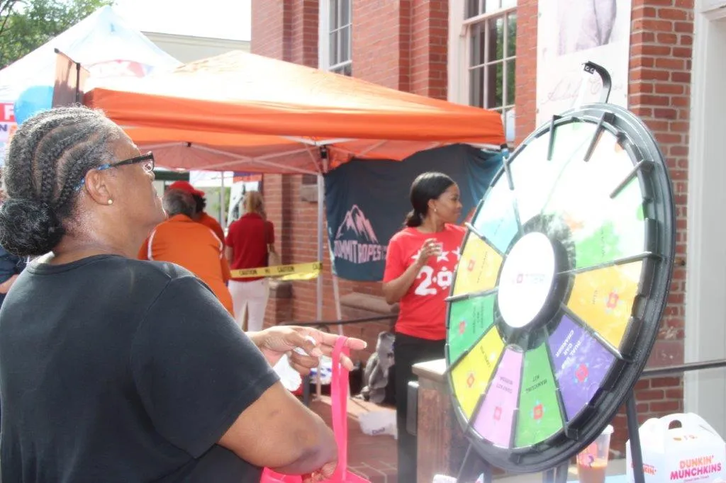 woman spinning prize wheel