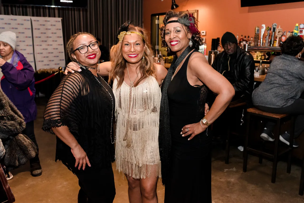 Three women posing for a photo