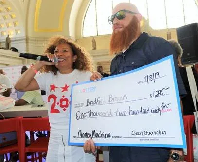 Man holding large check