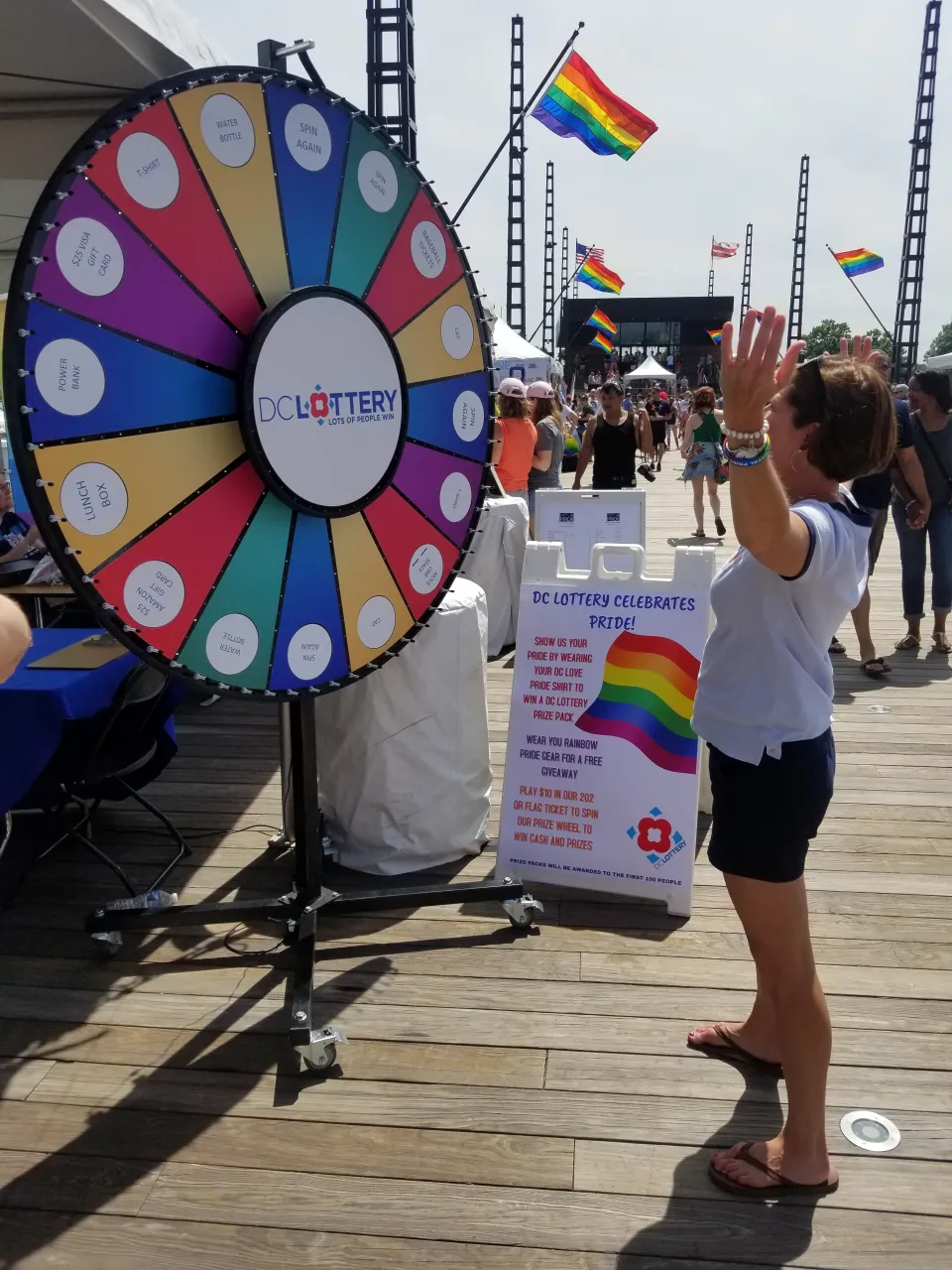 Woman spinning 60" prize wheel