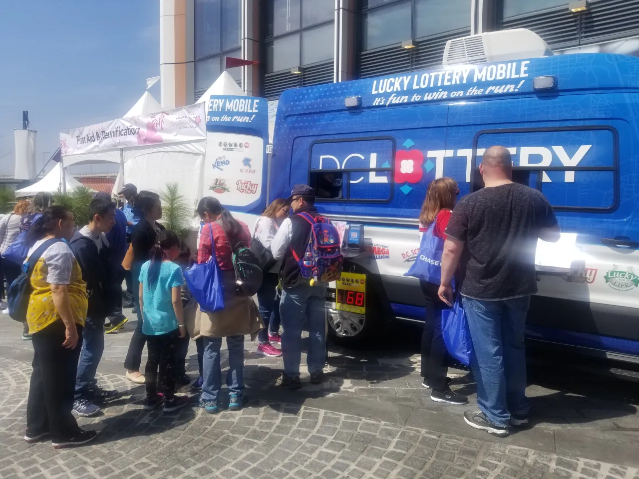 players waiting to purchase tickets at the lottery truck