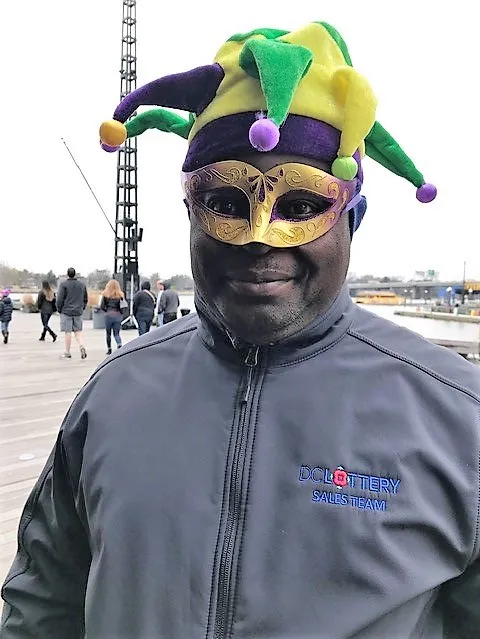 man wearing jester hat and mask