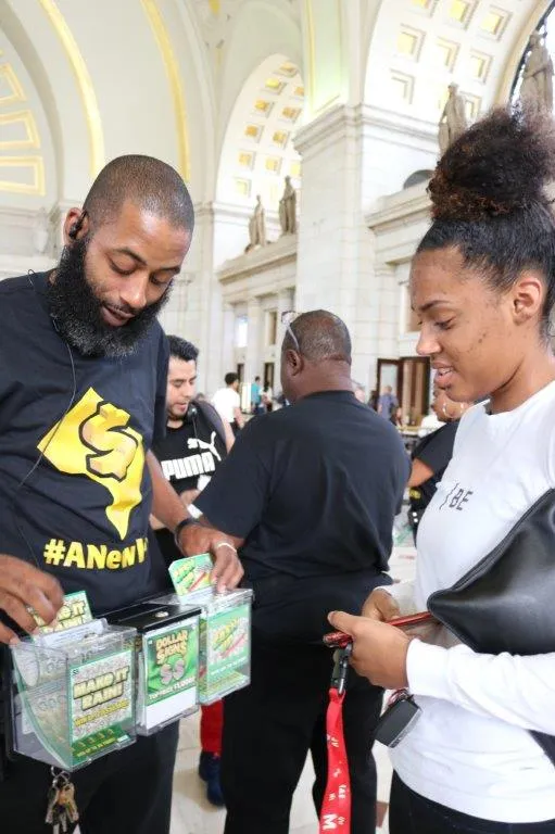 woman purchasing scratch tickets