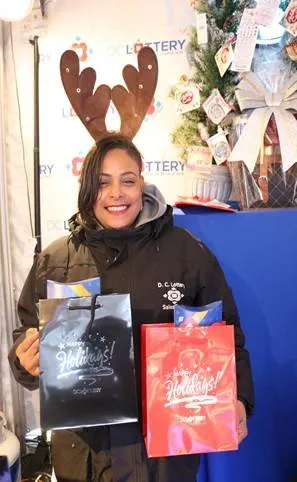 DC Lottery Hawker holding bundle bags