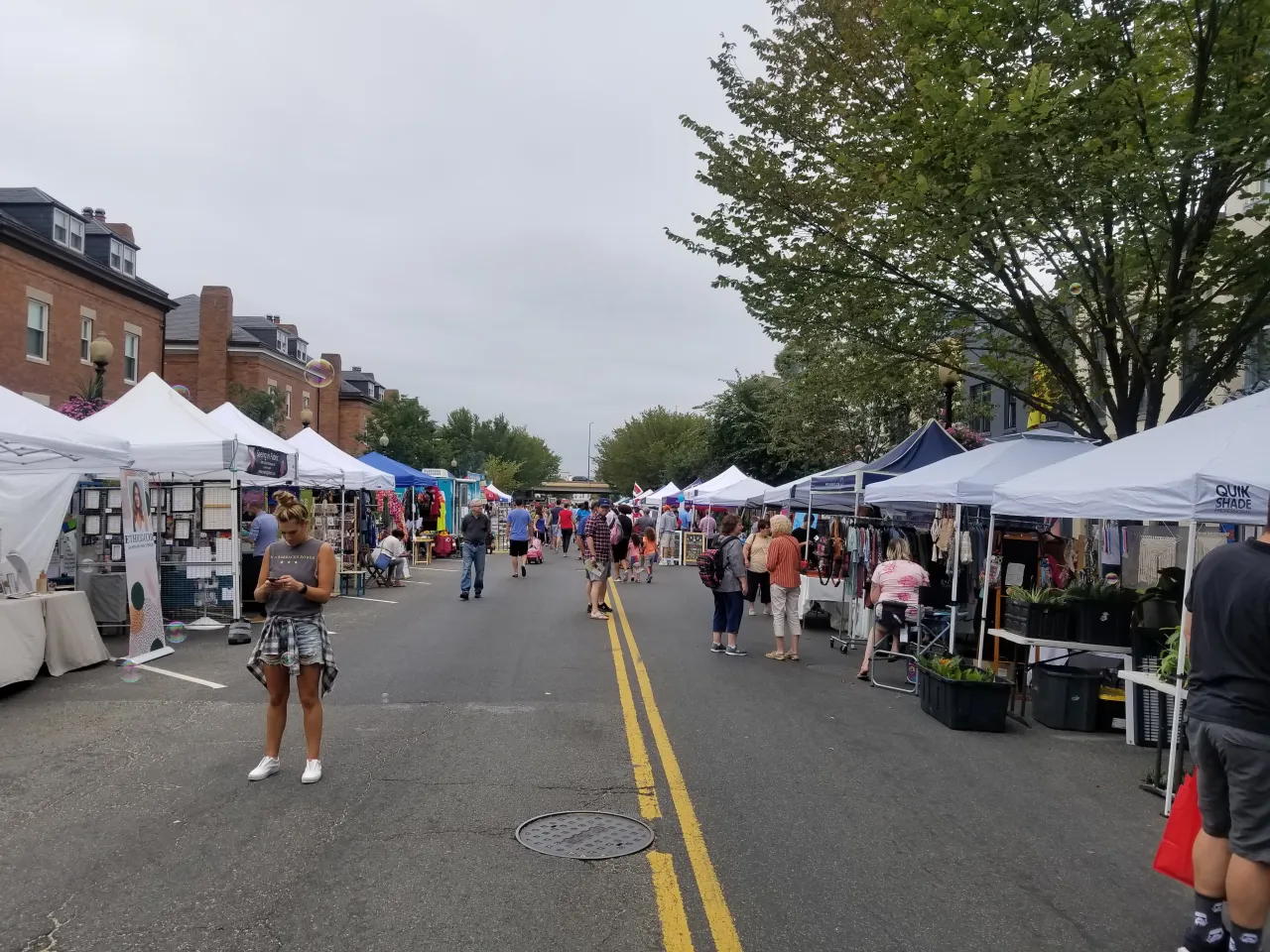 Festival street lined with vendor tents
