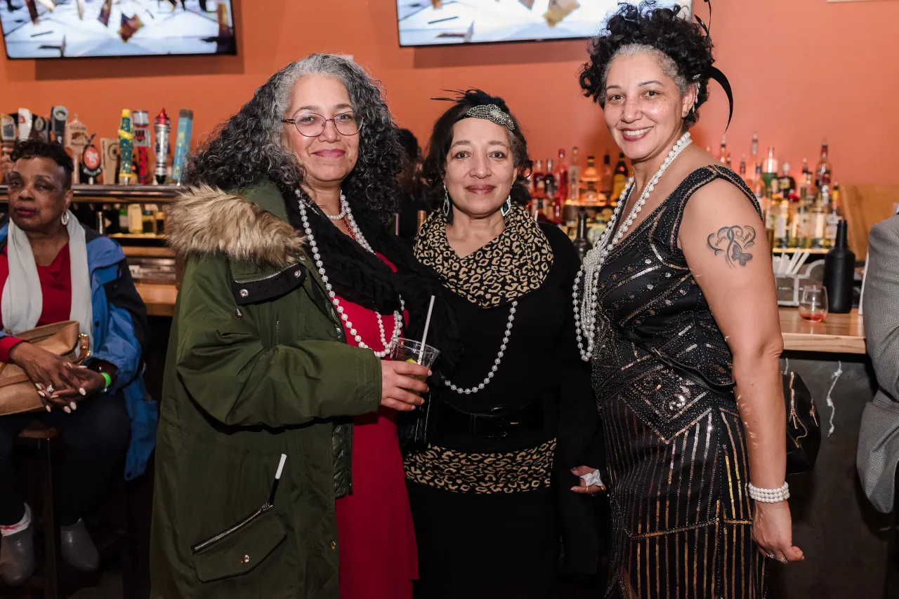 Three women posing for a photo