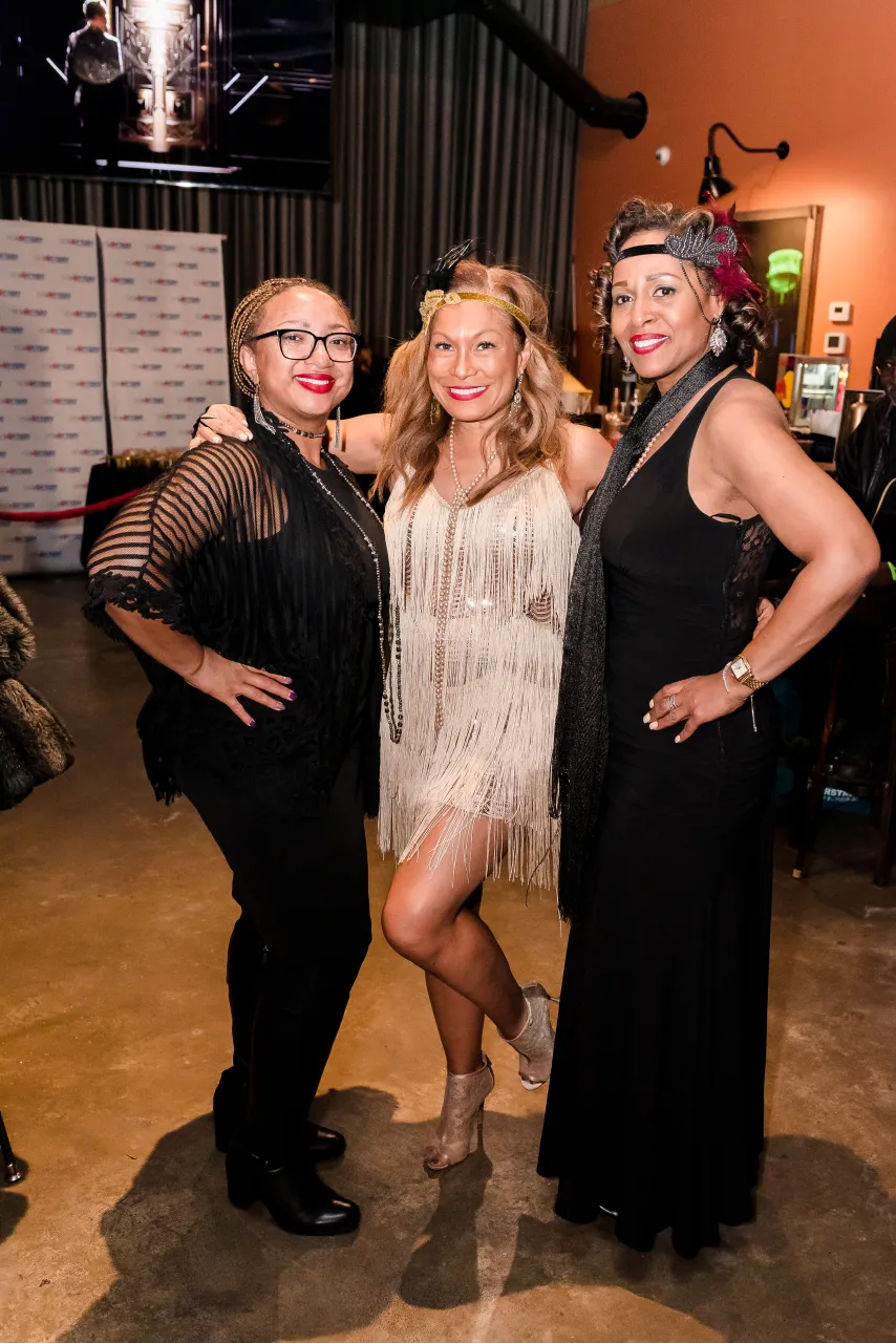 Three women posing for a photo